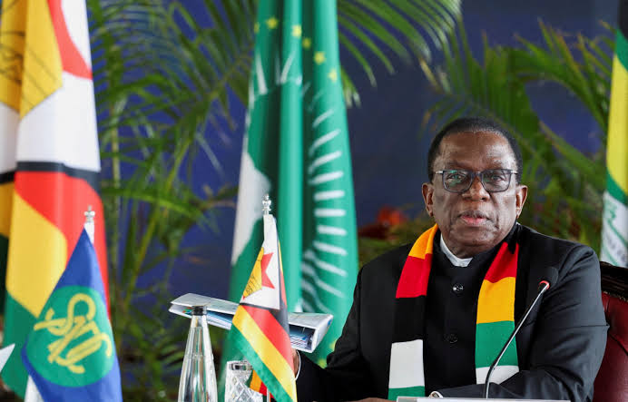 Zimbabwe's president has signed a law amending the constitution to extend his time in power.